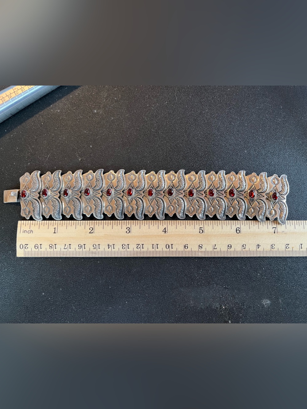 Sterling Silver Getco inc Concho style bracelet w garnet stones. Heavy. 7.5”